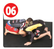 Next, Garry snaps his opponent down to the mat. He doesn’t go straight back, instead he snaps him down to his left, the side opposite his opponent’s head. This puts the most amount of pressure on his opponent.